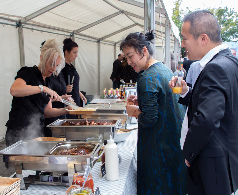 Allsee staff enjoying the BBQ buffet at the opening event