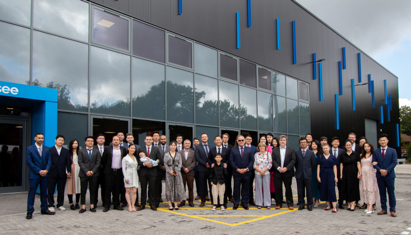 Allsee staff, friends and family group photo in front of new building