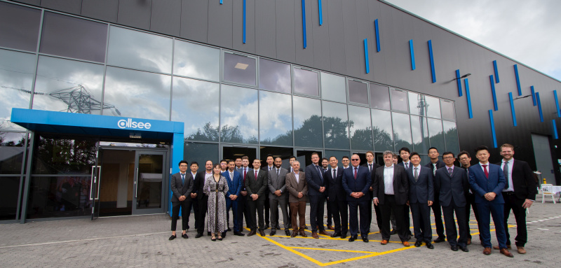 Group photo of staff members outside Allsee's digital signage headquarters 