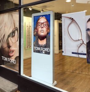 White Freestanding Digital Posters in shop window display