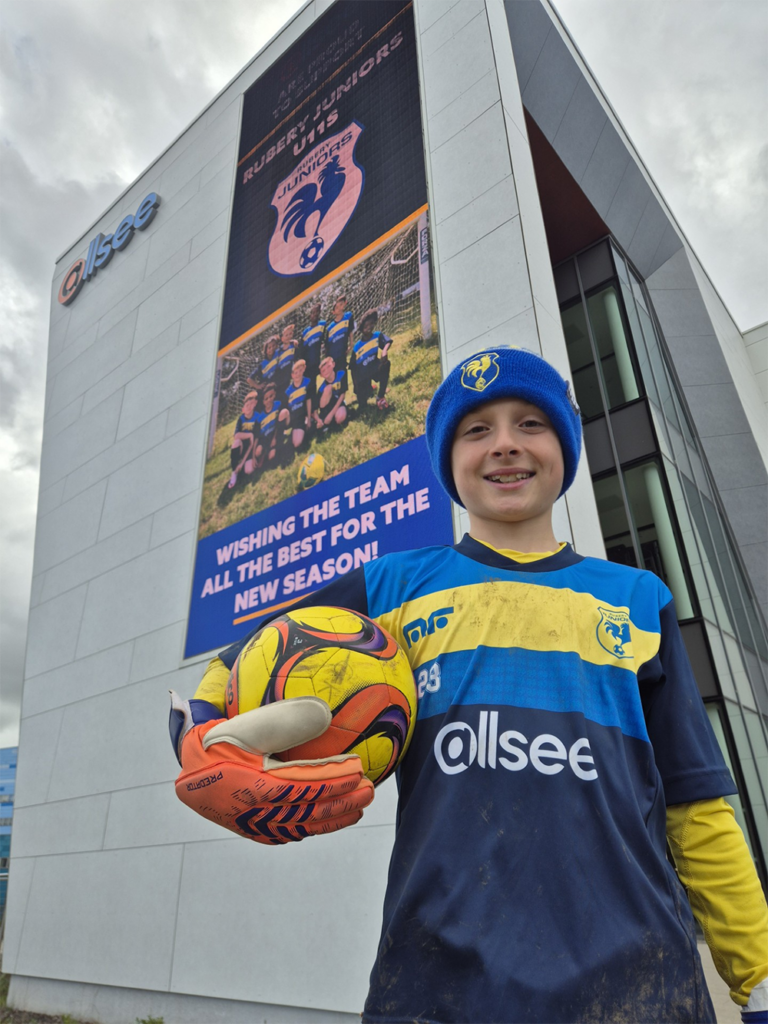 Rubery Juniors goalkeeper George beside the VieuPoint display at Allsee in Longbridge